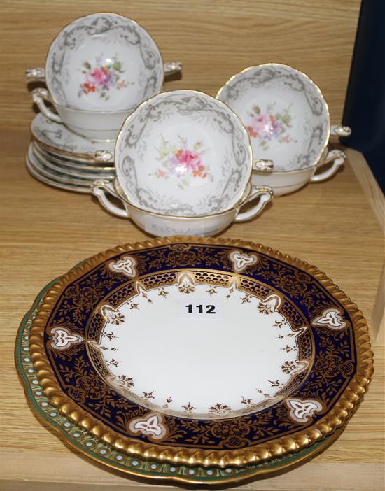 A set of six Royal Crown Derby two handled soup bowls and stands and two plates